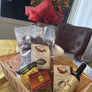 Gift basket contains Chile Pods, NM Olive Oil, Red Chile Powder, Posole and Salsa Mix.