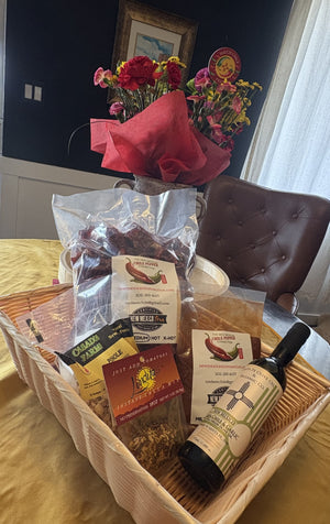 Gift basket contains Chile Pods, NM Olive Oil, Red Chile Powder, Posole and Salsa Mix. 